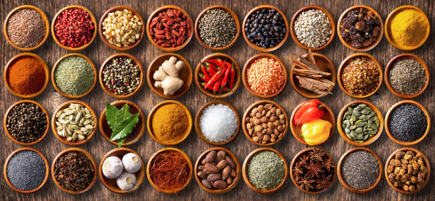 istock Colourful background from various herbs and spices for cooking in bowls 1473879537