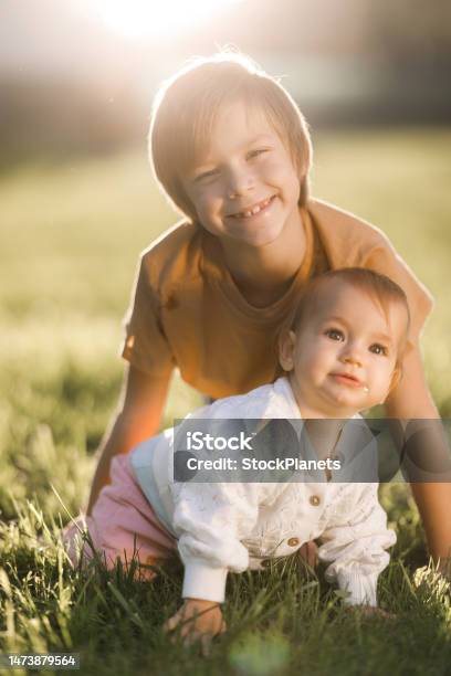 Happy Siblings Enjoying In Nature Stock Photo - Download Image Now - Child, Sibling, Baby - Human Age