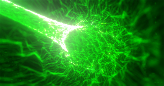 Abstract green tunnel swirling from lines and particles of triangles glowing futuristic hi-tech with a blur effect on a dark background. Abstract background.