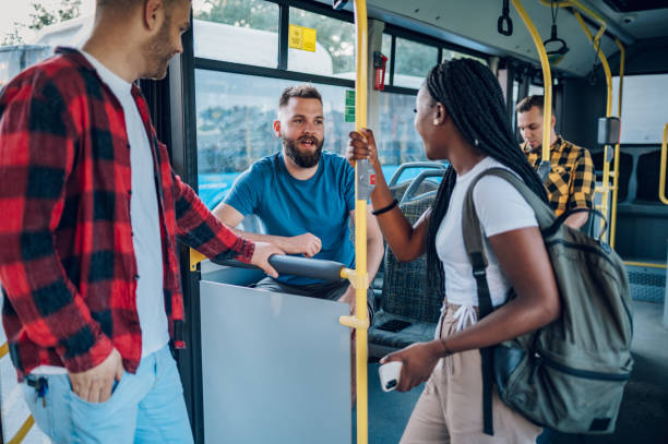 istock Multiracial friends talking while riding a bus in the city 1473882949