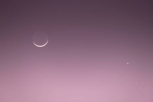 istock Venus-Saturn Conjunction along with a crescent Moon in the evening colorful sky 1473884178
