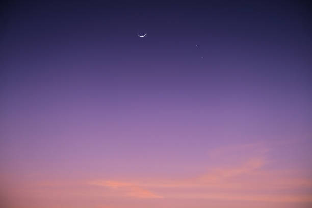 istock Venus-Saturn Conjunction along with a crescent Moon in the evening colorful sky 1473884706