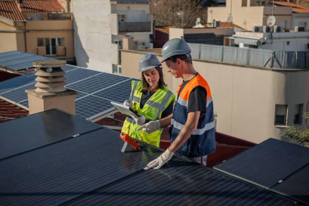 istock Engineers on roof for solar panels maintenance, inspection or installation 1473884840