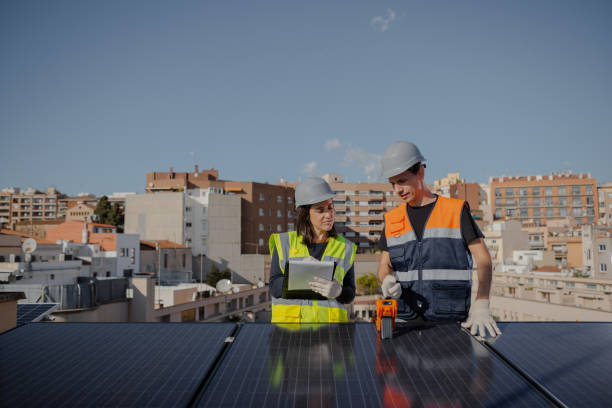 istock Engineers on roof for solar panels maintenance, inspection or installation 1473885003