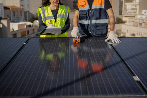 istock Teamwork and engineers on solar roof for maintenance, inspection or installation 1473885025