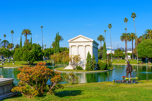 Los Angeles, California - December 20, 2022: Mausoleum and Pond at Hollywood Memorial Park