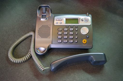 DECT radiotelephone Base station. Dect cordless phone wireless phone, radiotelephone, radio phone on grey background.