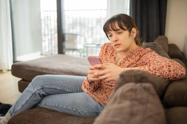 istock Happy young woman using phone 1473891507
