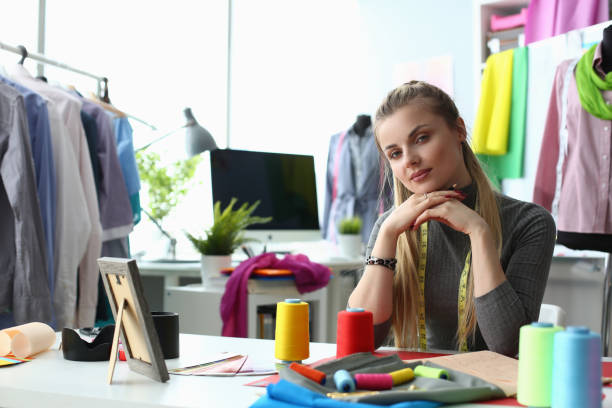 istock Beautiful woman designer stylist at workplace in creative studio 1473895516