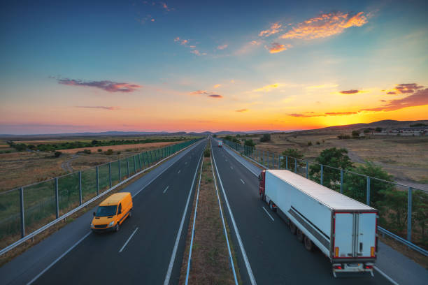 istock Driving on open road at beautiful sunset. Aerial view 1473895710