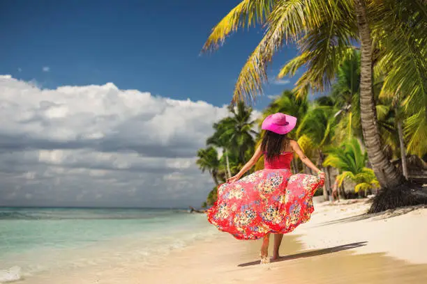 Carefree young woman relaxing on tropical beach. Saona Isla, Dominicana, Playa Punta Cana