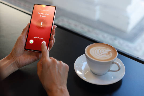 istock A woman receiving suspected spam call on smartphone from an unknown caller while having coffee in a cafe, copy space. 1473895885