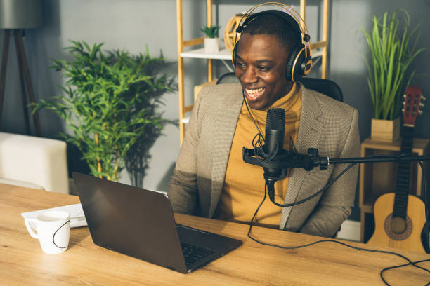 istock Man makes a podcast audio recording at home 1473895981