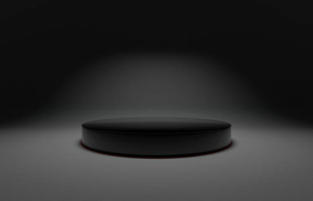 istock Black gloss circular podium or pedestal display on semi matte black background. Blank product cylinder standing backdrop. 3D rendered. 1 top down soft box light 1473897357