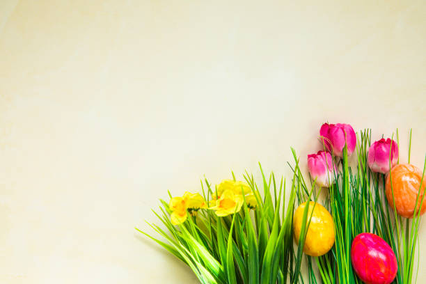 Happy easter! Flat Lay, postcard or Internet banner with Copy Space on Easter.  Bouquet of flowers and Easter eggs