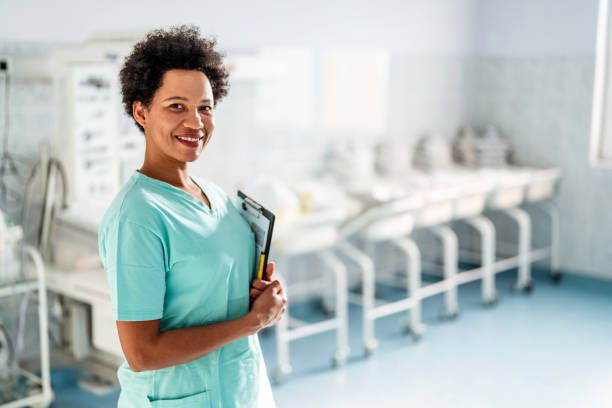 istock Smiling female nurse looking at camera 1473904929