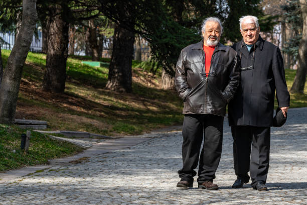 istock Active Senior Old Friends Having A Nice Day At The Park And Cafe, Walking. 1473905312