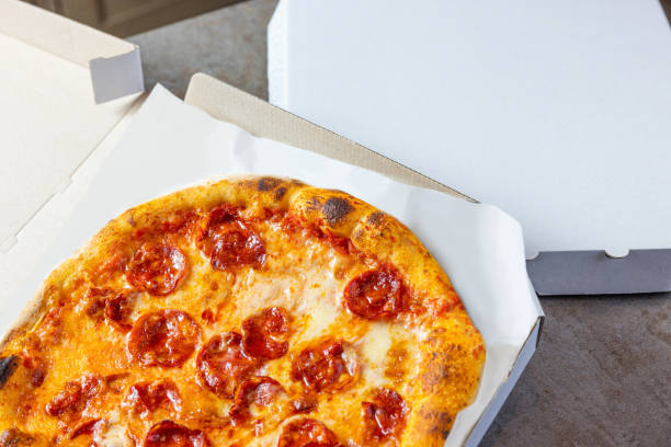 istock Baked Pepperoni in opened pizza box 1473905792