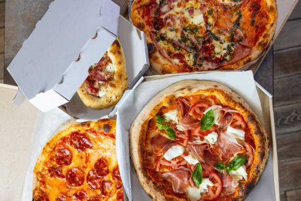 istock Various types of pizza delivered in boxes 1473906411