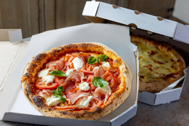 istock Delicious pizza delivered in boxes 1473906589