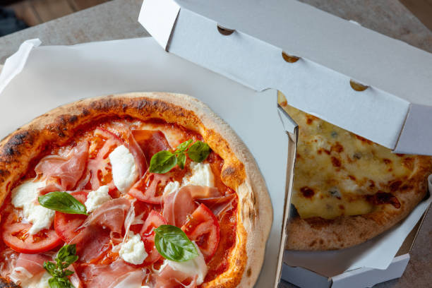 istock Close-up on delicious pizza delivered in boxes 1473906590