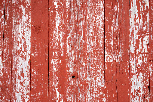 Detail of red wooden cabin on snowy shore in winter, Tromsø Norway