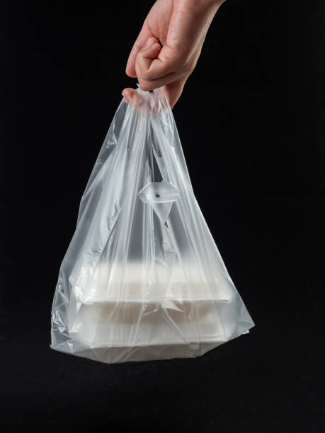 istock Holding Bento Box in Plastic Bag on White Background 1473908672