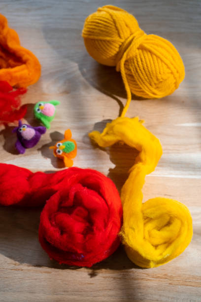 istock Felted cube and skeins of wool for felting 1473908736