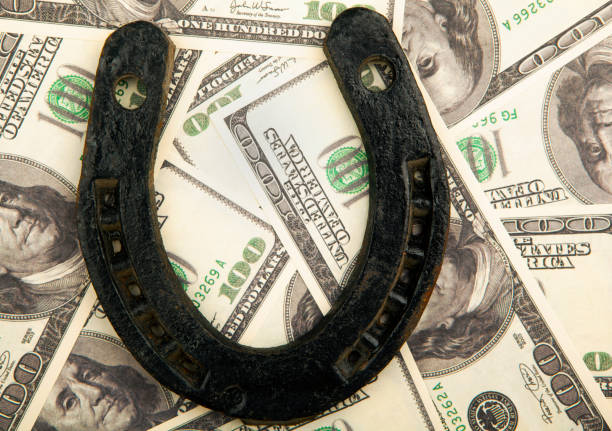 Close-up view of a rusty horseshoe mounted on an aged brick wall, showcasing texture and ample copy space for text or design concepts.