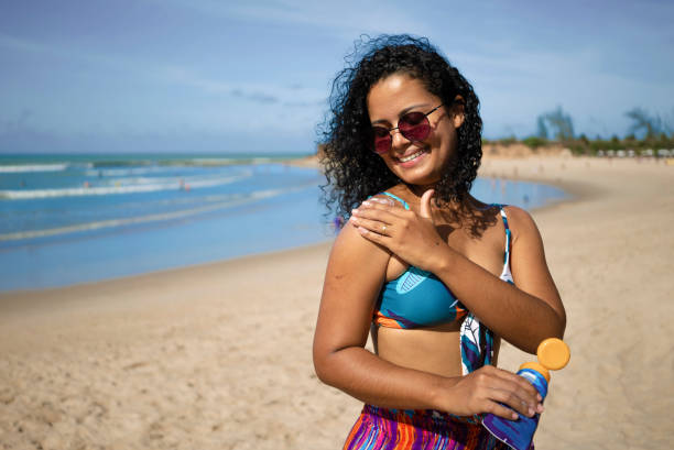 istock Woman protecting her body from uv rays 1473913934