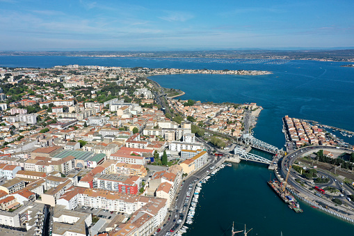 Sète is located in the region of Occitania, southern France. The image shows the City with Étang de Thau captured during a sunny day in spring season.