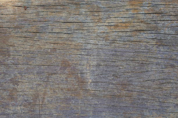 The old wooden floor has beautiful cracks.