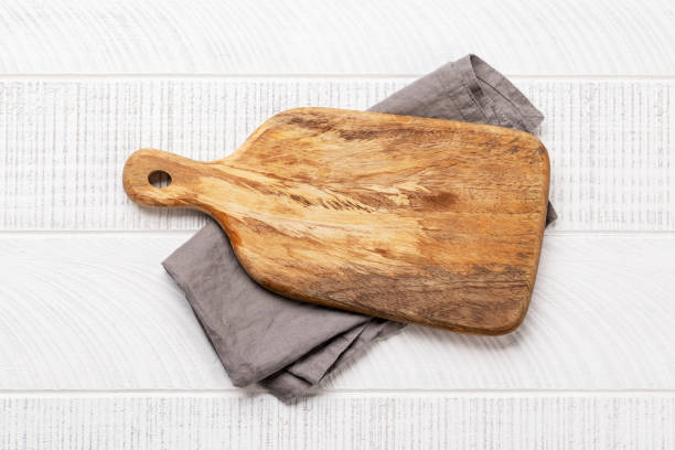 istock Wooden cutting board and kitchen towel 1473924707