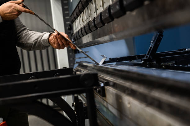 Sheet metal bending in factory Metal plate bending in factory. bending stock pictures, royalty-free photos & images