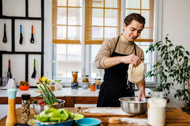 istock Man makes dough for homemade pasta 1473927807