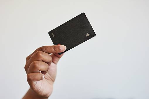 Hands, credit card and payment for online shopping in studio isolated on a gray background mockup. Fintech, ecommerce and black woman with digital finance for banking, buying or paying for sales.