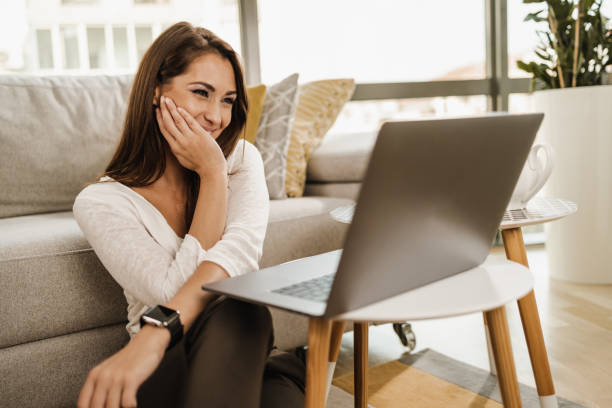 istock Woman Using Laptop At Home 1473932231
