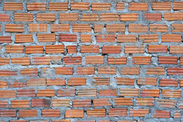 istock Red brick wall. Texture of old dark brown and red brick wall  backgorund. 1473932543