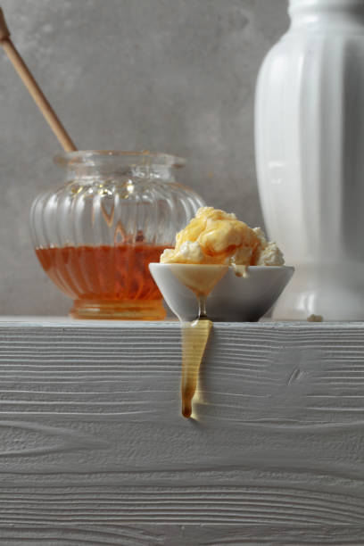 istock Fresh cottage cheese or ricotta with honey. 1473932727