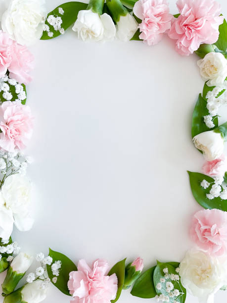 istock Pink floral. assorted pink flowers border on white 1473933765