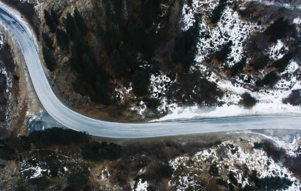 istock Asphalt road through mountainous valley 1473933892