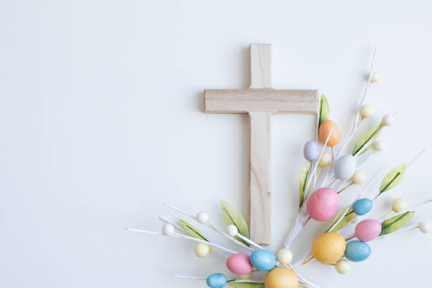 Cross with easter eggs on a white background stock photo