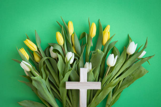 istock Cross on a bed of tulips 1473934280