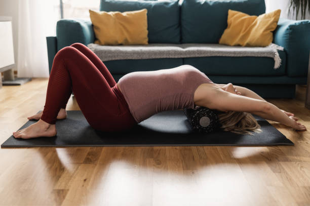 istock Pregnant Woman Doing Workout With Foam Roller At Home 1473934559