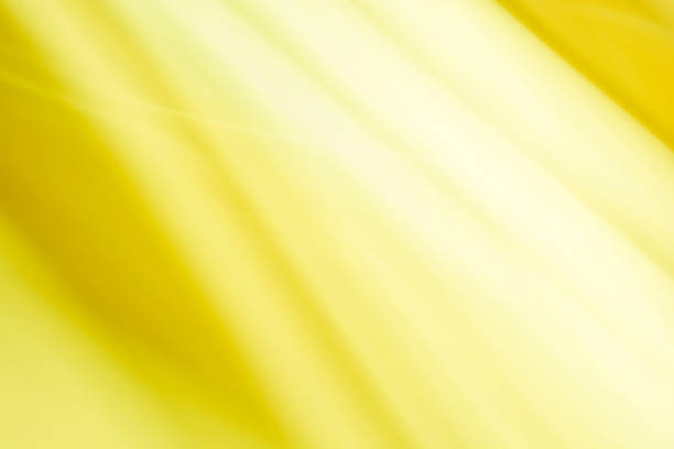 istock abstract yellow background with some smooth lines in it and some rays in it 1473937480