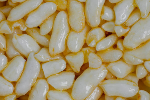 Puffed honey rice - macro, close up, top view. Oriental sweet, texture, gastronomy and Asian food concept