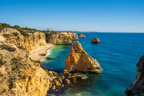 Beautiful cliffs and rock formations at Marinha Beach in Algarve, Portugal Beautiful cliffs and rock formations by the Atlantic Ocean at Marinha Beach in Algarve, Portugal praia da marinha stock pictures, royalty-free photos & images