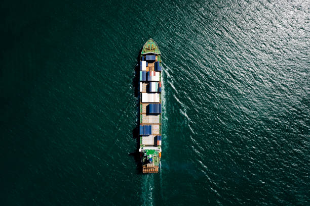 istock container ship sailing on the green sea full speed container for logistics, import export, business and Industry by shipping or transportation Worldwide ocean freight 1473944978