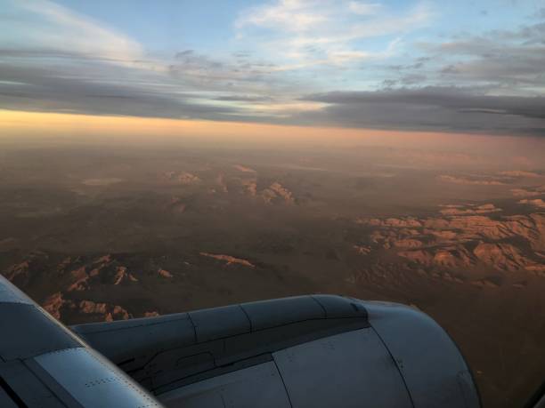 istock Window seat view - beautiful view from an airplane - sunset from a plane - mountain landscape 1473947397