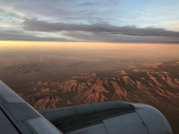 istock Window seat view - beautiful view from an airplane - sunset from a plane - mountain landscape 1473947412